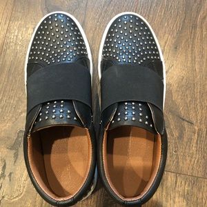 Black studded sneakers